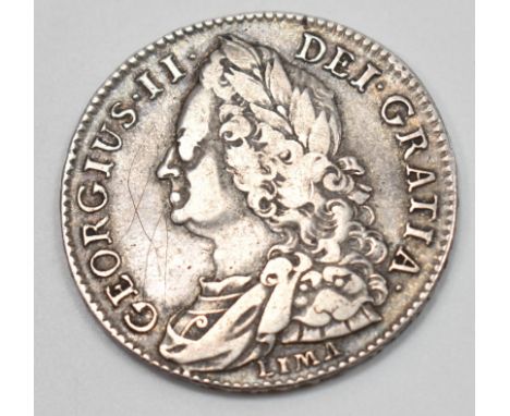 A mid 18th century King George II .925 silver shilling coin with the obverse having the older King's portrait engraved by Joh