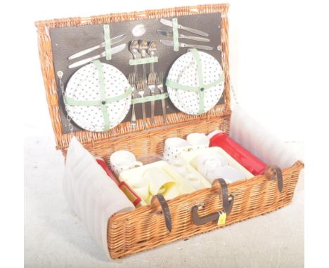 A vintage retro late 20th century Brexton Collection wicker picnic basket set. The set includes plates, cups, cutlery, thermo