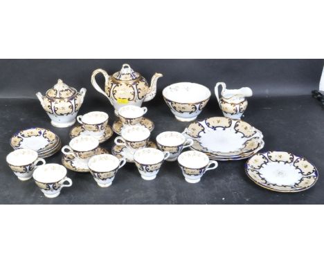 A Victorian 19th century bone china tea service in the style of coalport. The tea service comprising of teacups, saucers, a s