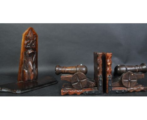 A pair of vintage 20th century wooden bookends in the form of canons. Together with a carved wood corbel wall shelf / sconce 