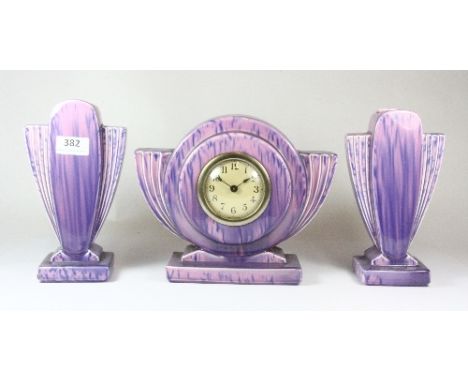 An Art Deco ceramic clock garniture