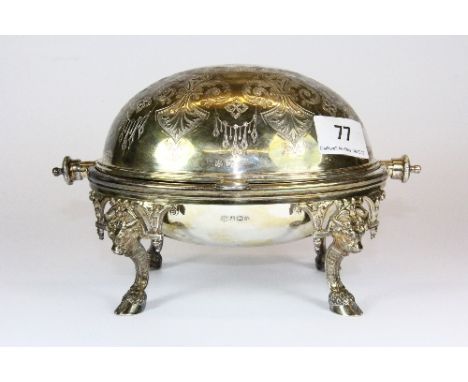 A heavy hallmarked silver and glass lined caviar dish on bull head and hoof legs, Sheffield circa 1922 makers mark TC/JWC, W 