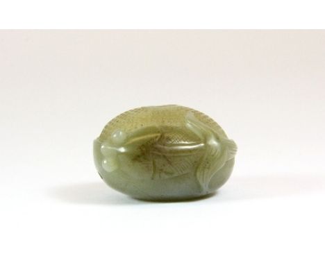 A fine early 20th century carved jade lobster basket in a lotus leaf with a fan tailed fish, Dia 3.5cm