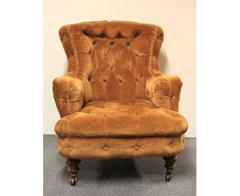 A Victorian button backed gentleman's armchair
