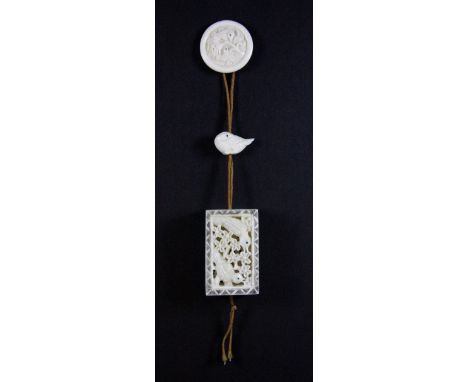 A carved bone inro, ojima and netsuke