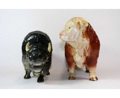 A large Melba ware ceramic figure of a bull (H 25cm) and a similar large unmarked figure of a bison
