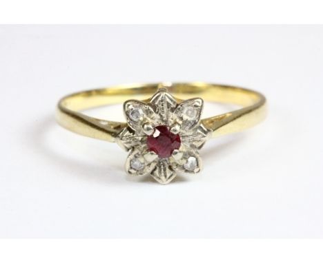 An 18ct gold ruby and diamond daisy cluster ring (Q)