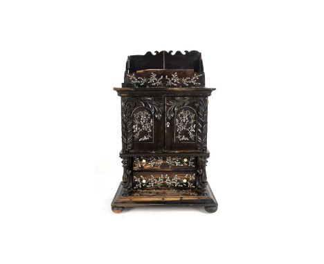 A 19th Century Anglo-Indian ebony correspondence cabinet, inlaid throughout with inlaid ivory to a floral design, the letter 