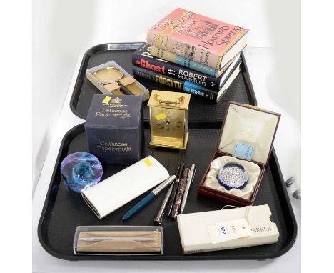 A selection of desk accessories, including: Metamac gilt cased carriage clock; two boxed Caithness glass paperweights; magnif