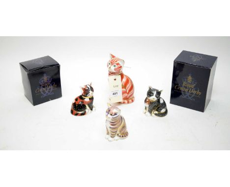 A collection of four Royal Crown Derby ceramic cat paperweights, including: Calico Kitten; Black &amp; White Kitten; and two 