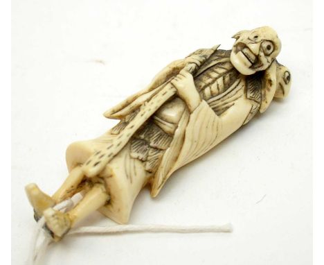 An 18th/19th Century Japanese carved bone netsuke, formed as a male figure, 8cms high.