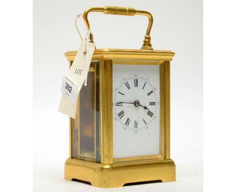 A 20th Century French gilt cased carriage clock, the white enamel Roman dial with outer Arabic seconds markers, platform leve