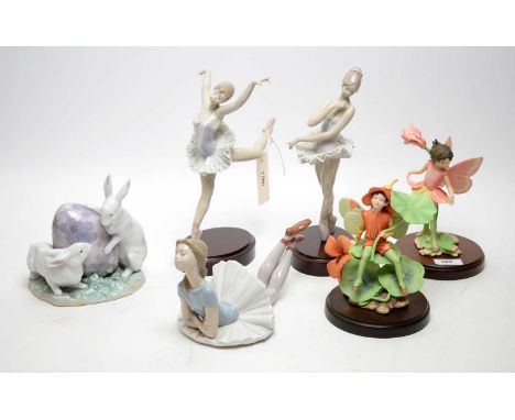 Three Lladro figures of ballerinas, comprising: two mounted upon stained wood bases and another; together with a Lladro figur