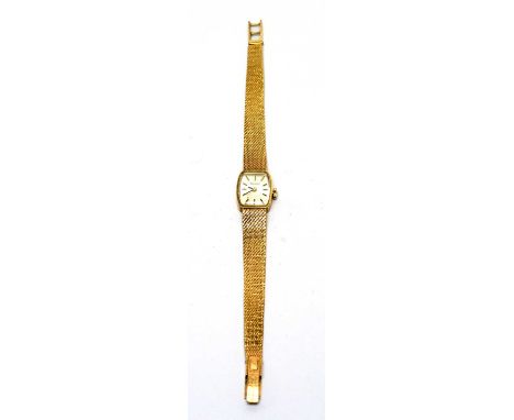 A Tissot 9ct yellow gold cocktail watch, with baton dial, manual wind movement and mesh strap, 23.6g gross.