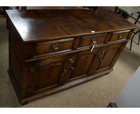 Attributed to Titchmarsh and Goodwin: a Georgian-style oak dresser, the rectangular top above three short drawers with three-