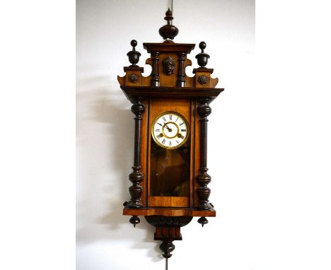 A Victorian mahogany wall clock, the white enamel Roman dial within architectural case, 85cms high.