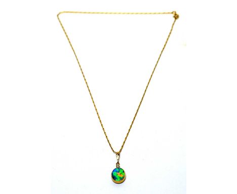 An opal and diamond pendant, in 9ct yellow gold mount and chain. 