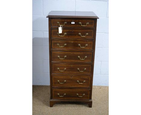 James Shoolbred &amp; Co., London: an early 20th Century mahogany and satinwood banded chest, the rectangular moulded top abo