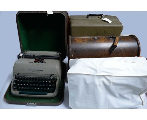 An Elna Supermatic sewing machine, in carry case; together with a Singer Sewing Machine in case; a Janome sewing machine; and