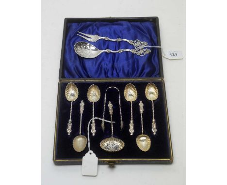 A set of six apostle type silver coffee spoons with shell pattern bowls, matching tongs and casting spoon, cased; and a Norwe
