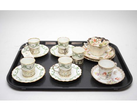 Four Aynsley ceramic coffee cans and saucers, each with silver holder; together with a further Aynsley coffee can with holder