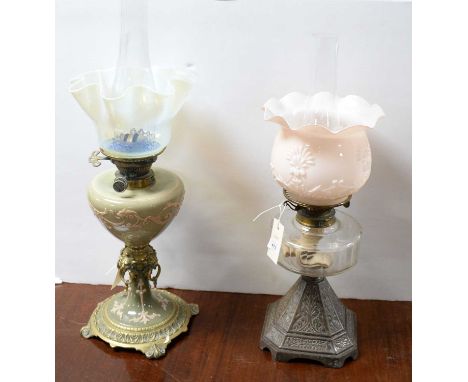 A Victorian brass oil lamp, with green sprigged Jasperware style reservoir and support, frilled Vaseline glass shade, 60cms h