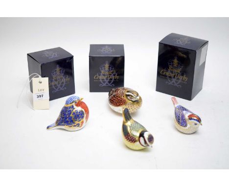 A collection of four Royal Crown Derby ceramic bird paperweights, three with boxes.