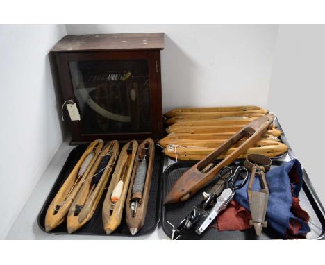 A collection of woollen mill instruments, purportedly from Otterburn Textile Mill, including: boat shuttles; Wilkinson 'Senio