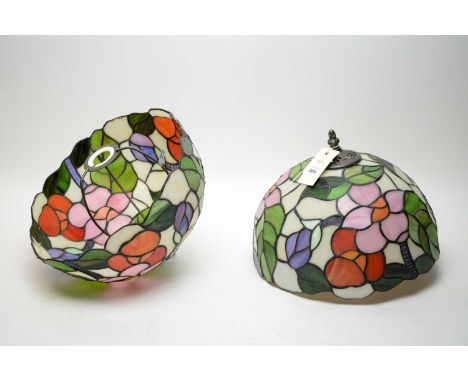 A pair of leaded stained glass effect light shades, each bearing colourful floral designs, 30cms diameter.