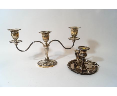 A loaded silver three light candelabra, Birmingham 1970, 19 cm high, 34.5 cm across; and a plated candlestick with snuffer/wi