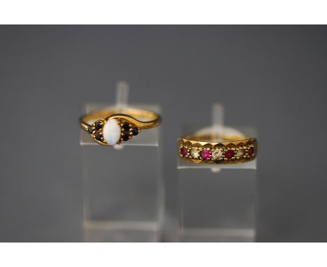 A 9 carat gold opal and sapphire ring; with a 9 carat gold stone set half hoop eternity ring;3.5 g gross