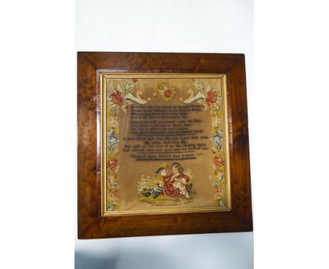 A Victorian woolwork sampler with religious verse by Margaret Agnes Howarth, aged 11 years, framed 61cm x 57cm overall