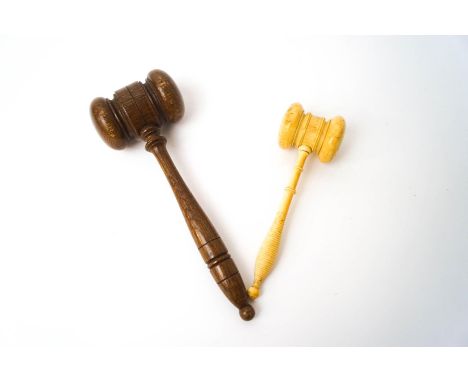 A late 19th century turned ivory gavel, 15cm long, and a wooden gavel, 20cm long