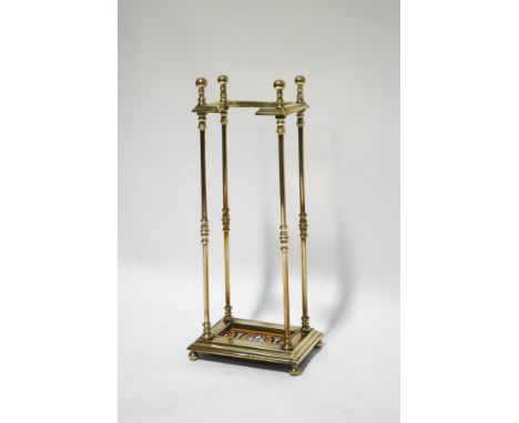 A Victorian brass stick/umbrella stand with inset tile to base, 71cm high x 24cm wide x 22cm deep