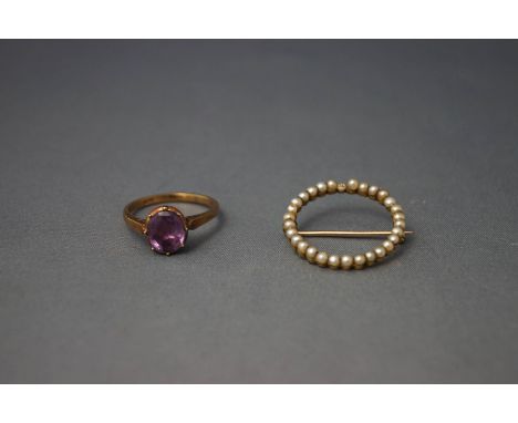 A single stone ring, stamped '9ct'; and a seed pearl circlet brooch