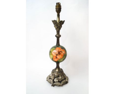 A metal table lamp with spherical Moorcroft central body, 47cm high