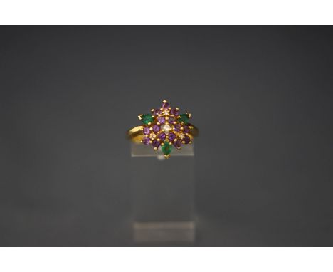 An amethyst, emerald and diamond cluster ring in the colours of the Suffrage movement, ring size P, stamped '750' and '18k' 5