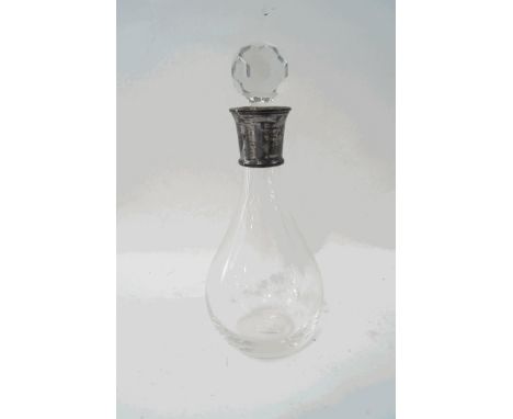 A glass decanter and stopper with silver collar, engraved Special Place Time Person