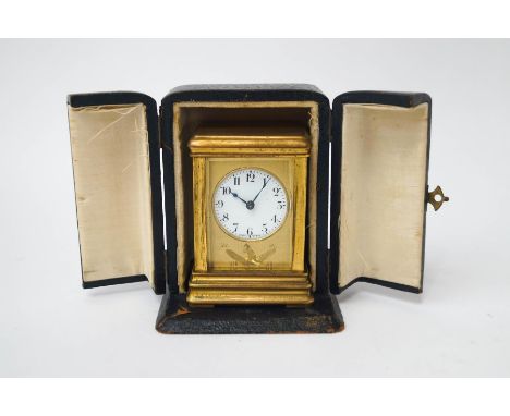 A French miniature brass carriage clock, made for the Australian market, the dial surround engraved with a kangaroo on a boom