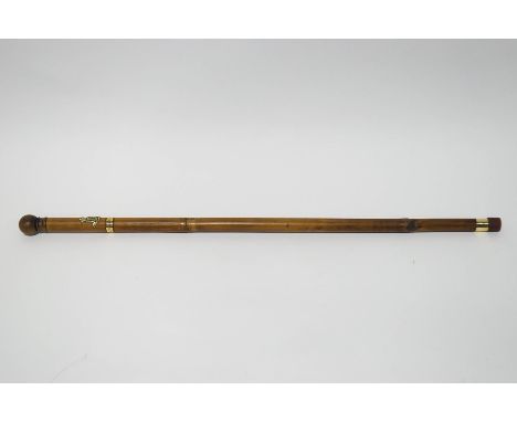 A substantial military stick with badge of the Royal Irish regiment