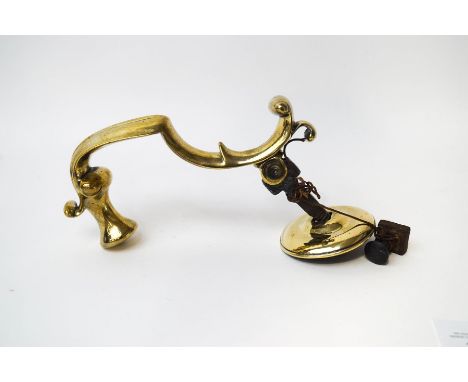 A heavy brass Victorian door knocker 