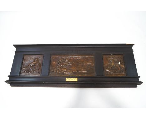 A Victorian set of three bronzed tiles depicting Hero and Leander, by Henry Poole, set within an ebonised wooden mount with e