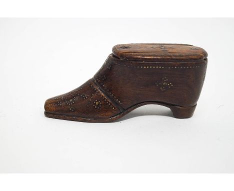 A late 18th Century treen snuff box in the form of a shoe with brass decoration, 9cm long