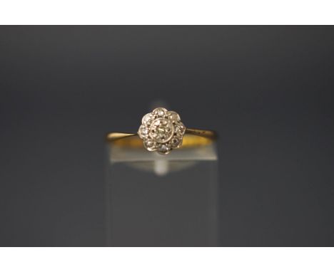 A five stone diamond  flower head cluster ring, stamped '9ct', finger size N, 1.4 g gross