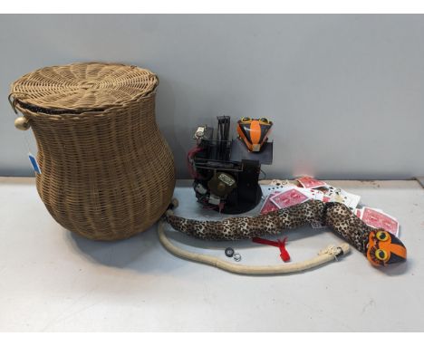 A vintage 1980's collectors workshop magic 'Khyber Kobra' with wicker basket and one other snake along with playing cards A/F
