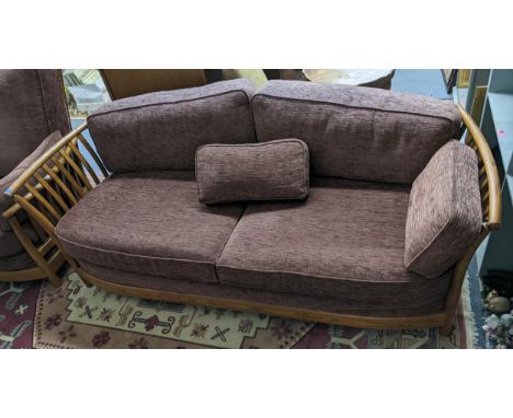 An Ercol elm Golden Dawn sofa with a matching armchair Location: 