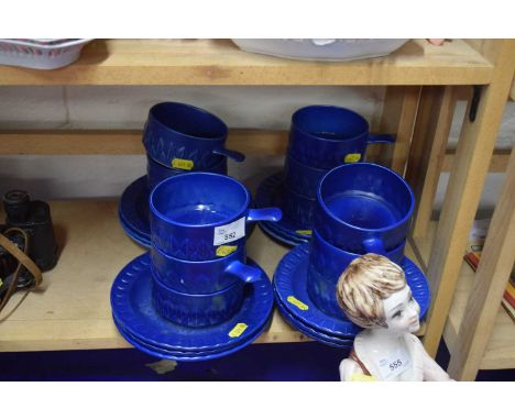 Quantity of blue glazed Holkham Pottery, cups and saucers
