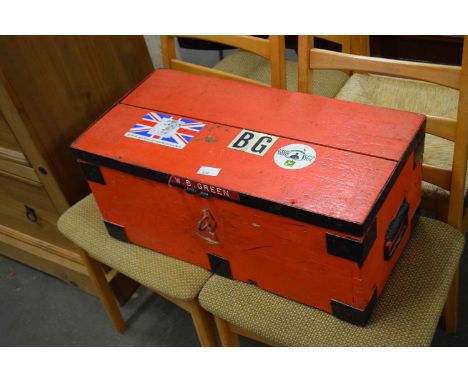 A small red painted trunk