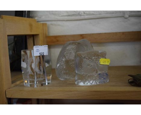A glass badger, glass owl and a further dolphin paperweight