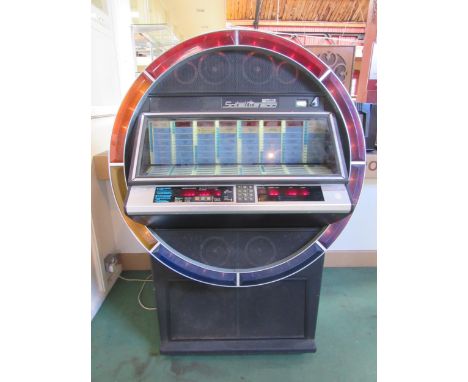 A 1980s NSM Satellite 200 vinyl jukebox, earlier model with multi-coloured ring of lights to front which pulsate in time with